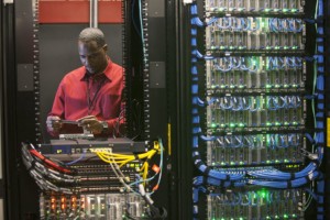 Server room technician working on server panel